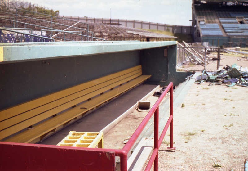 The third base (visitor) dugout with its original bat rack